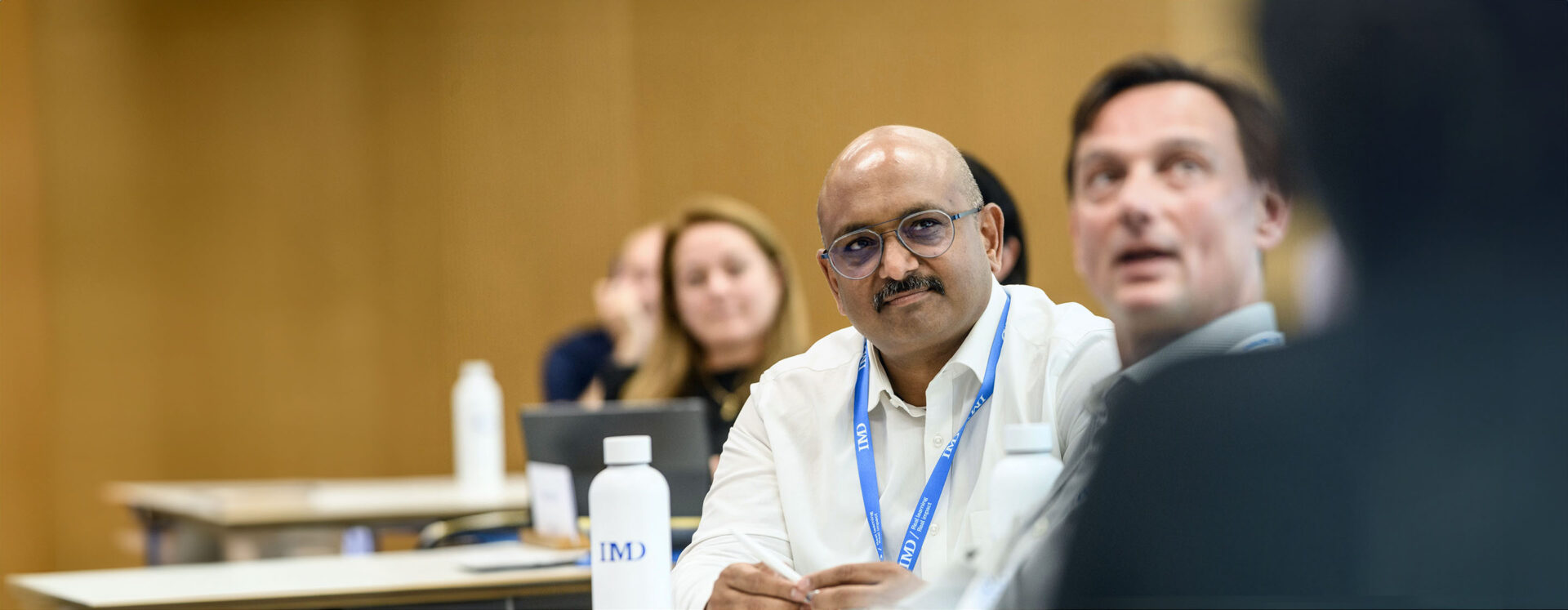 20231207-GlobalPages-ExecutiveEducation-TopBanner-BlueFilter-Desktop-2880×1120 - IMD Business School