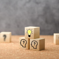 cubes showing a brainstorming session on concrete background